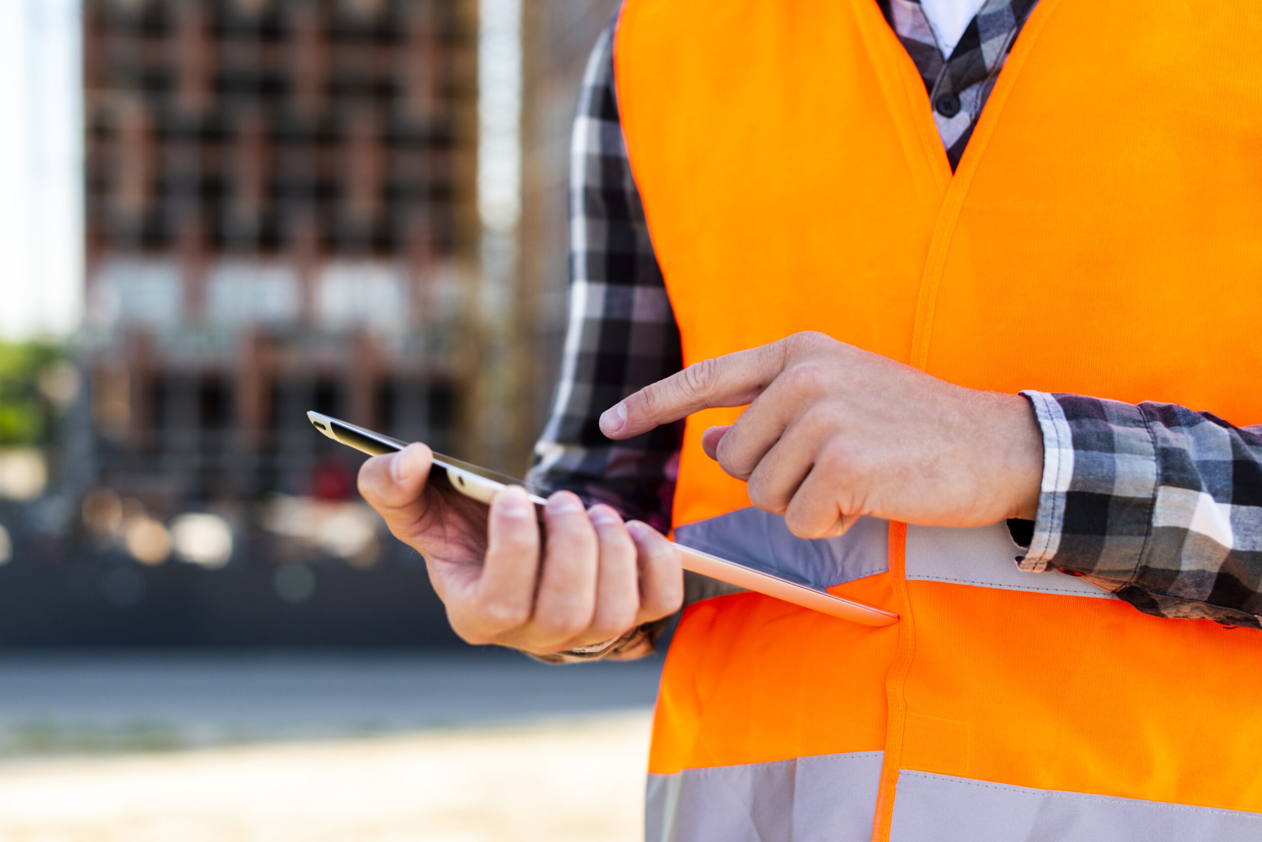 close up construction engineer using tablet 1 scaled
